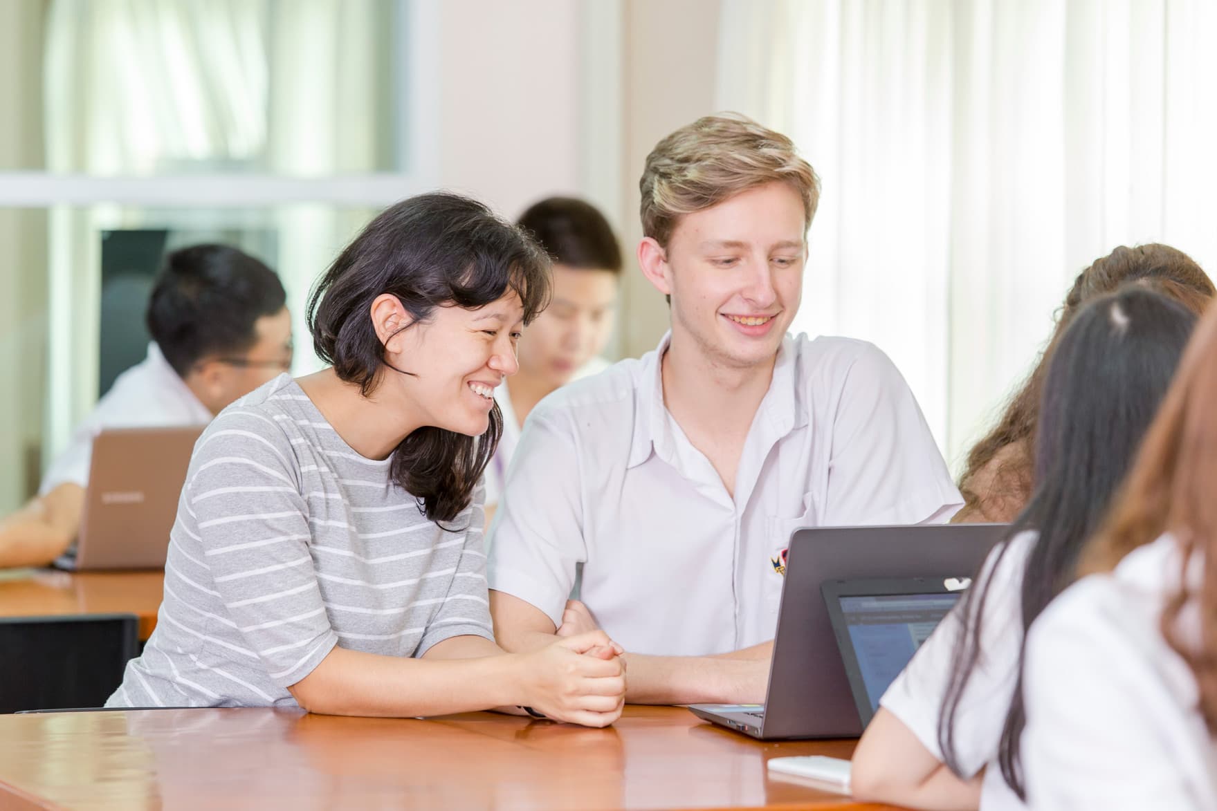A NIVA teacher working together on a project.