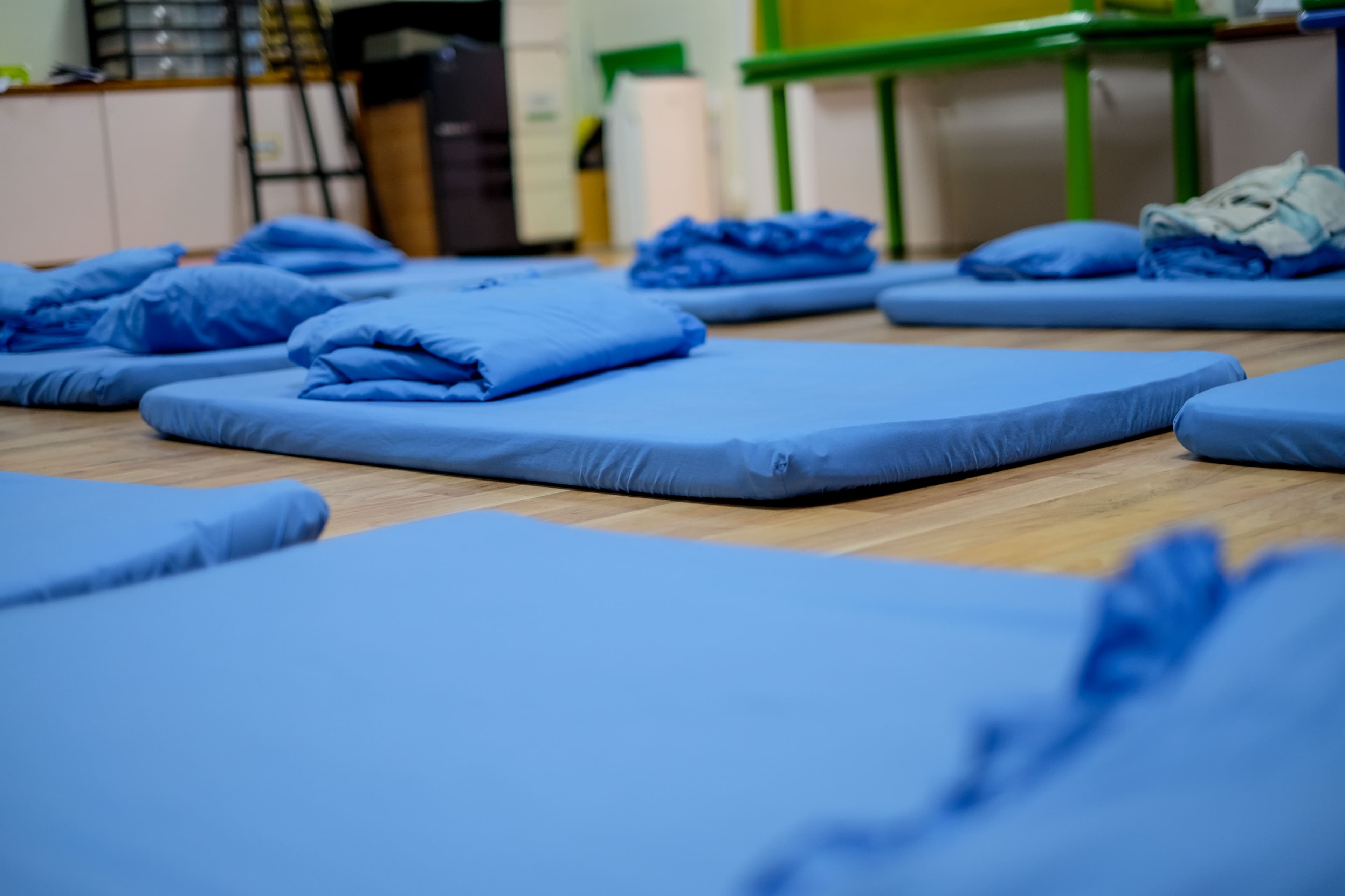 Blue futons laid on the floor for NIVA American International School's kindergarten nap time