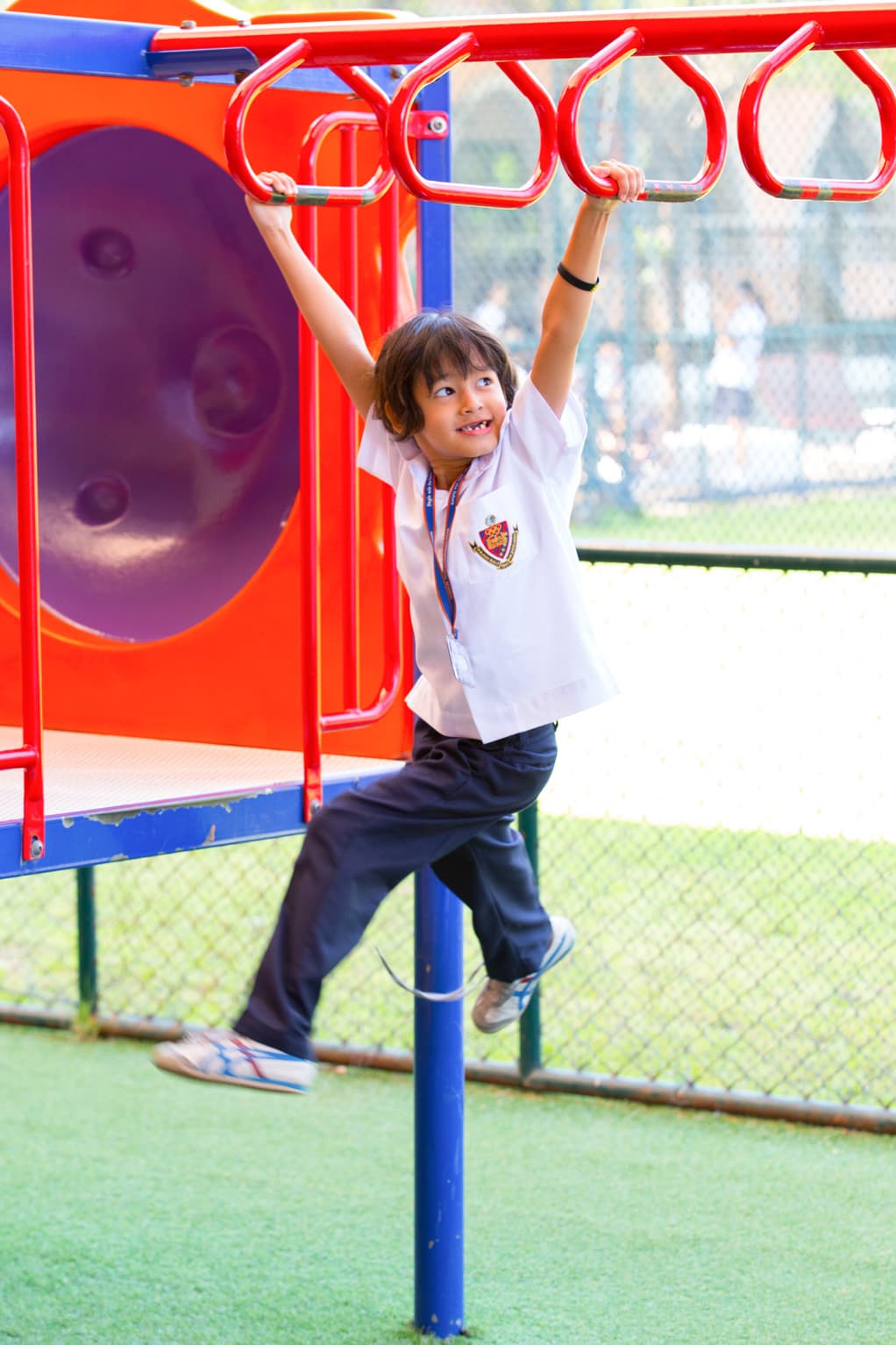 NIVA Playground - A boy monkey swinging in the playground