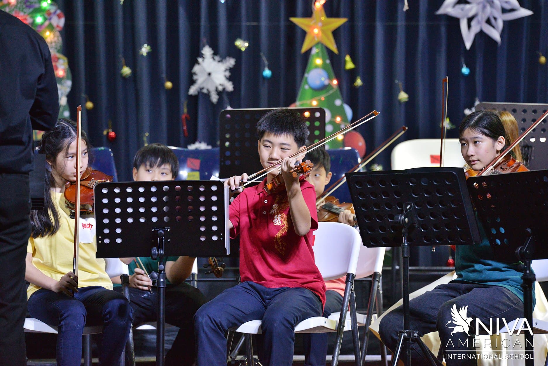 NIVA Music - Middle school students performing on stage