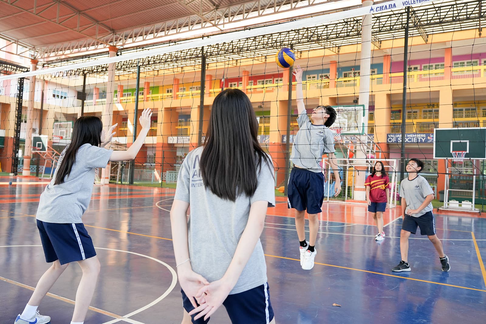 NIVA Multipurpose Court - A student spiking in a volleyball game