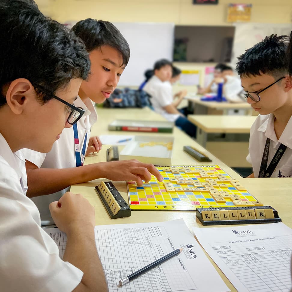 Students playing scrabble for English classwork