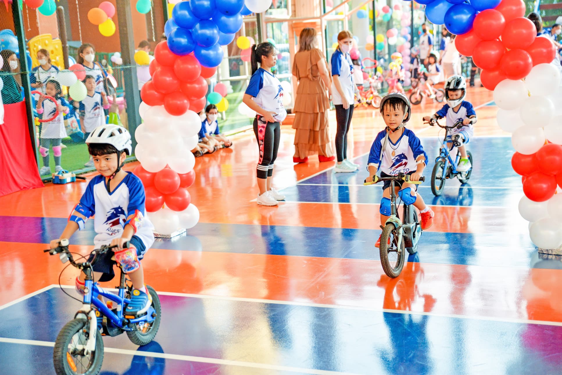 NIVA Multipurpose Court - Three boys cycling on the court
