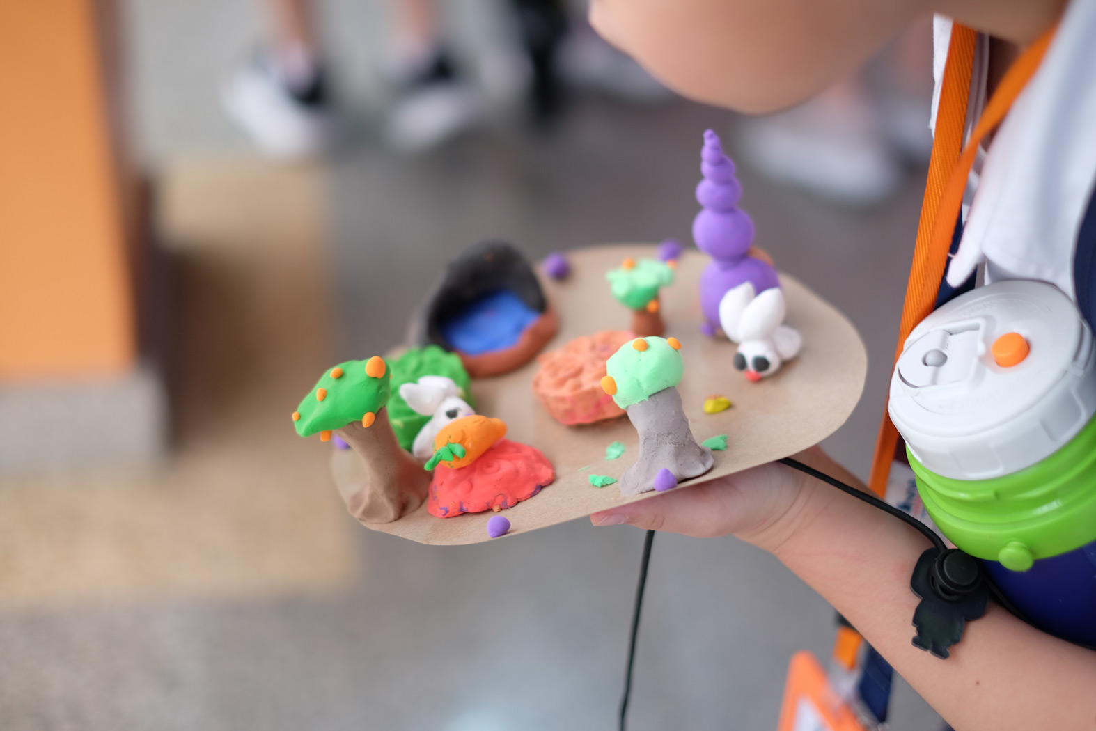 Colorful clay figures displayed on a palette