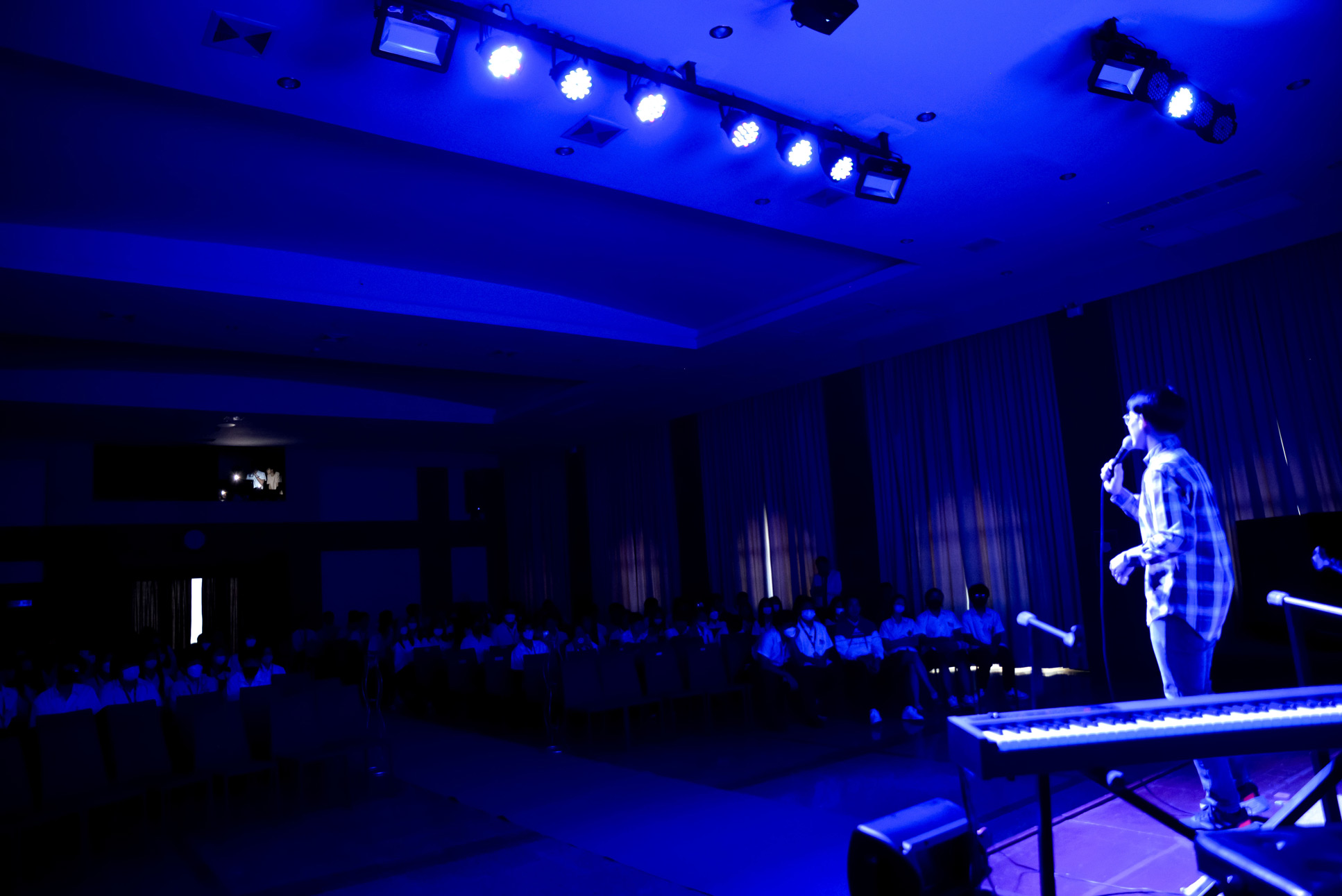 Heisler Hall lit in blue during a performance