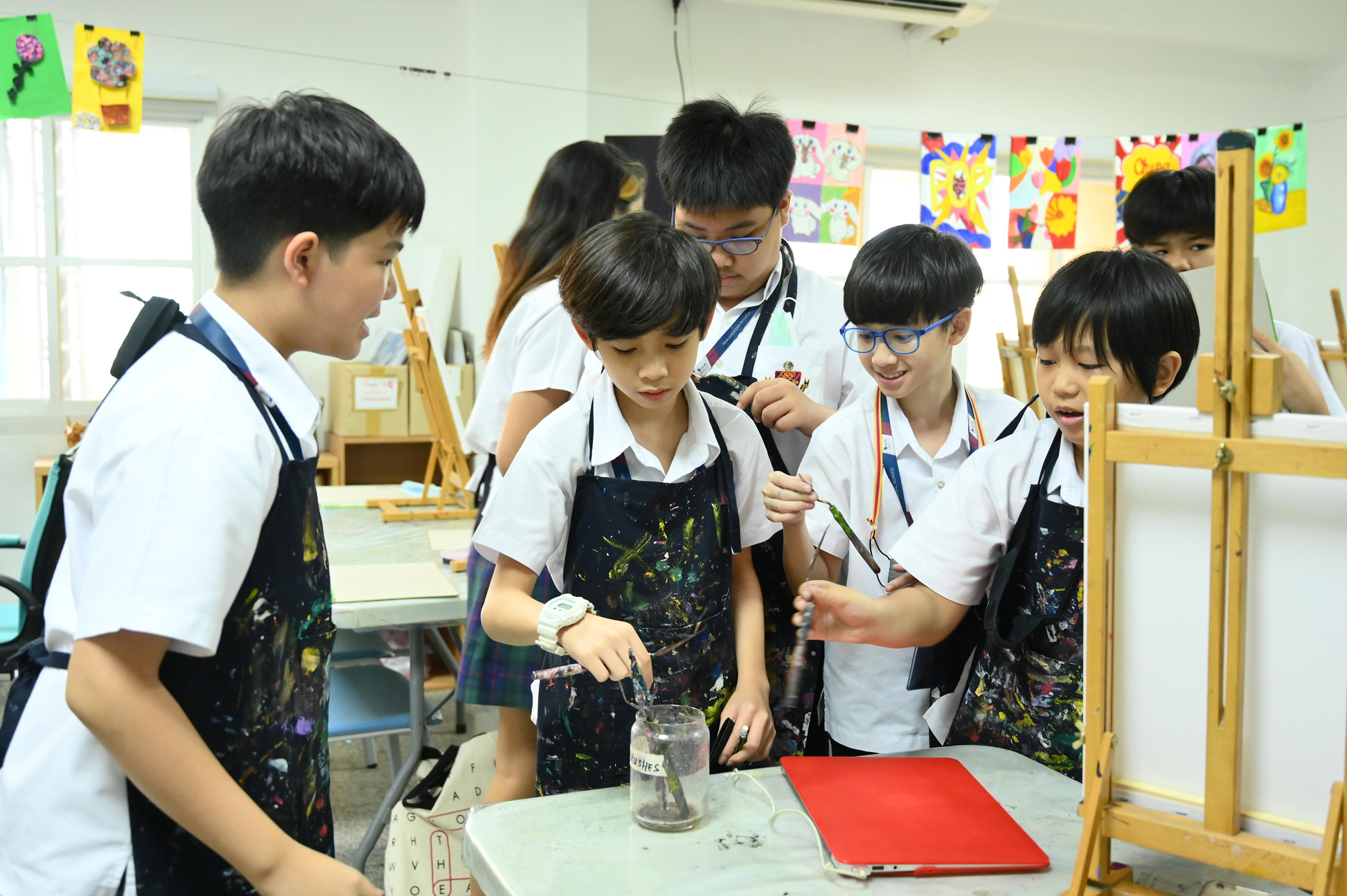 Students shaping clay in the art room