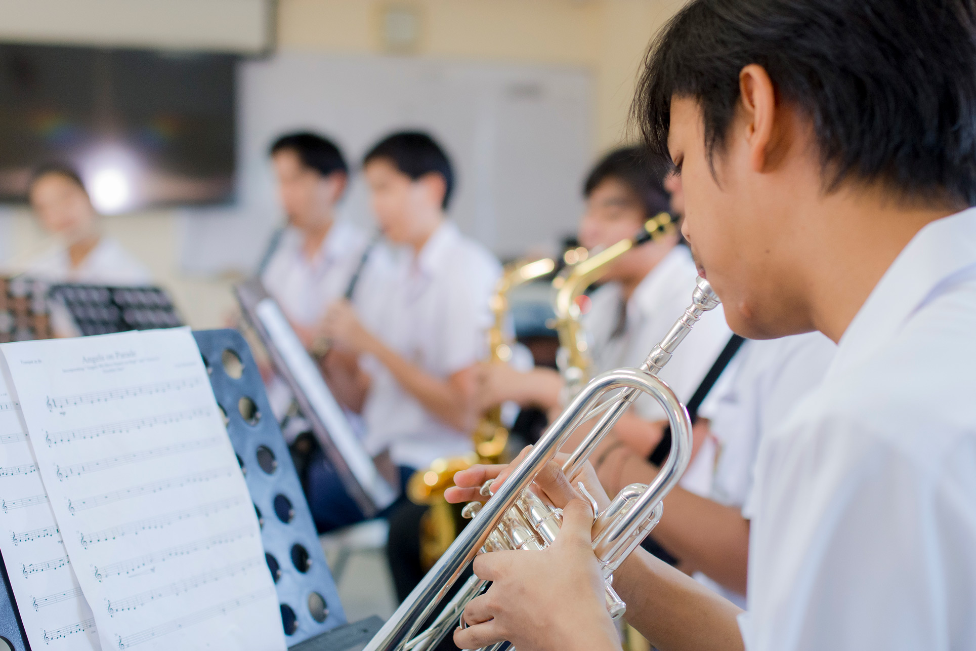 Student playing the trumpet in music class