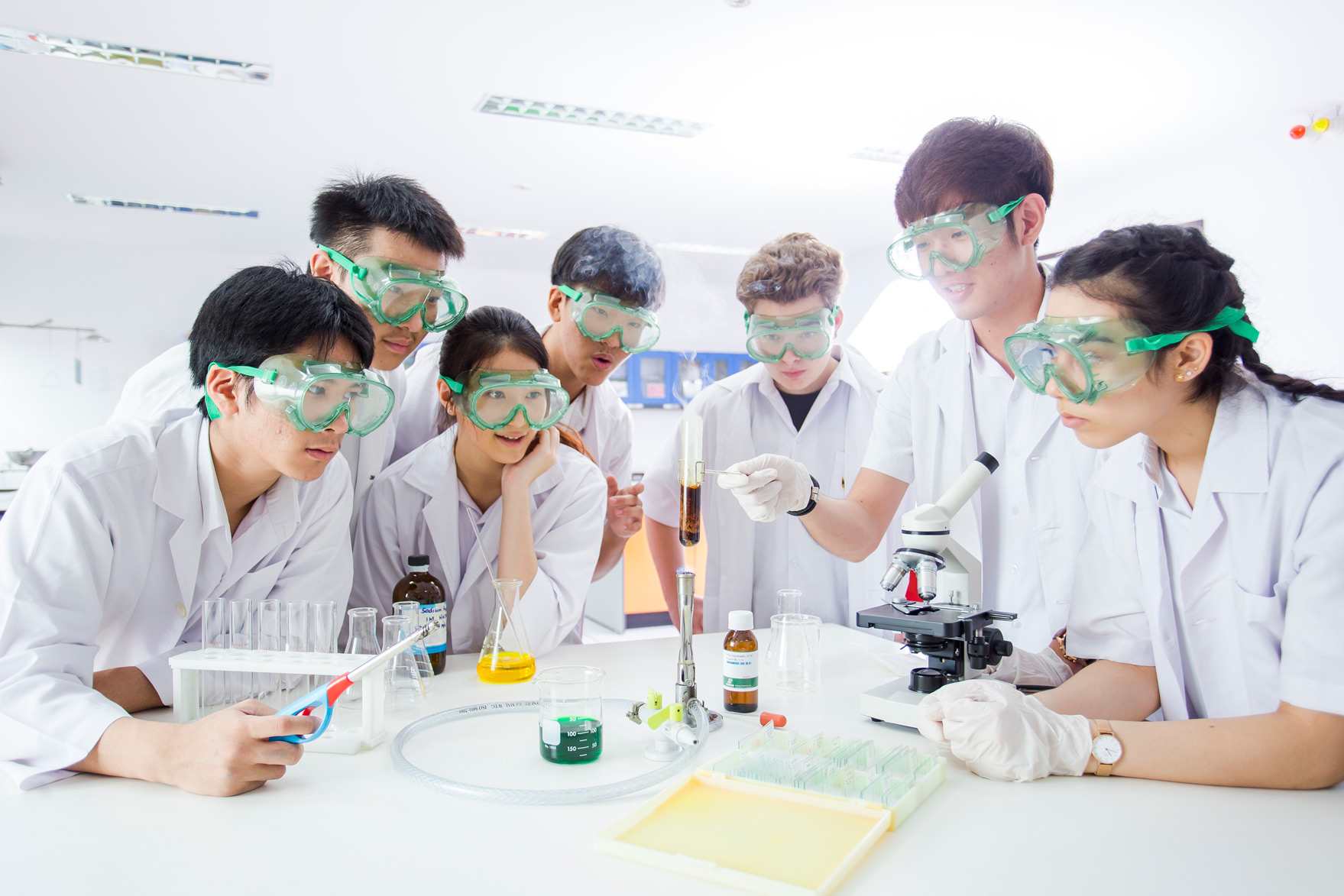 Students wearing safety goggles during a science experiment