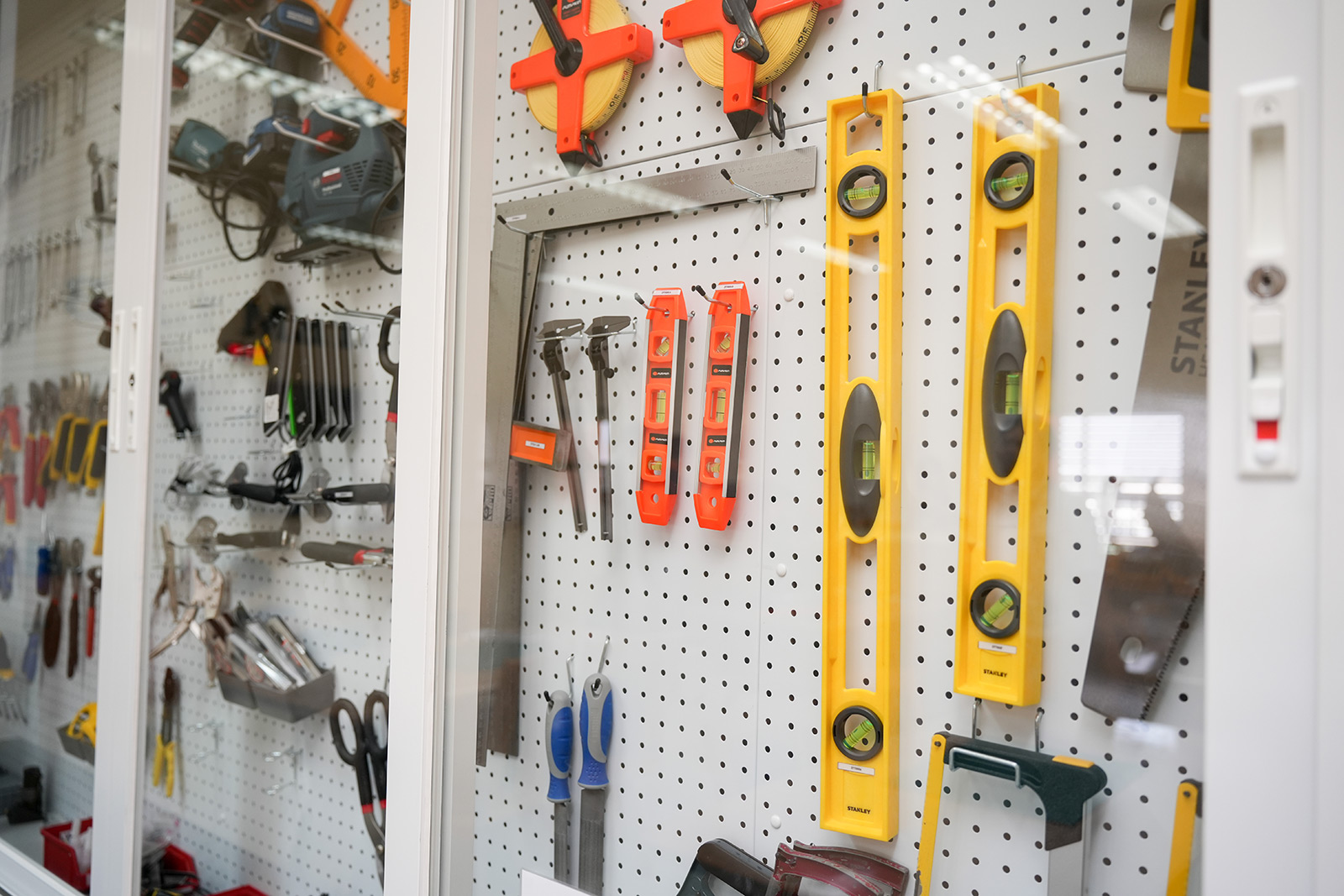 Hand tools arranged on a STEM lab tool board