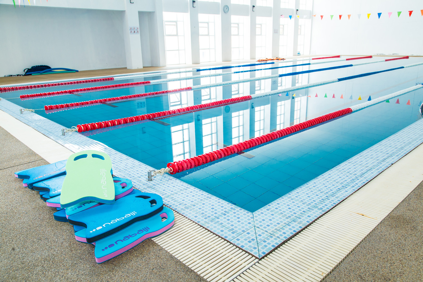Swimming pool with foam kickboards beside the lanes