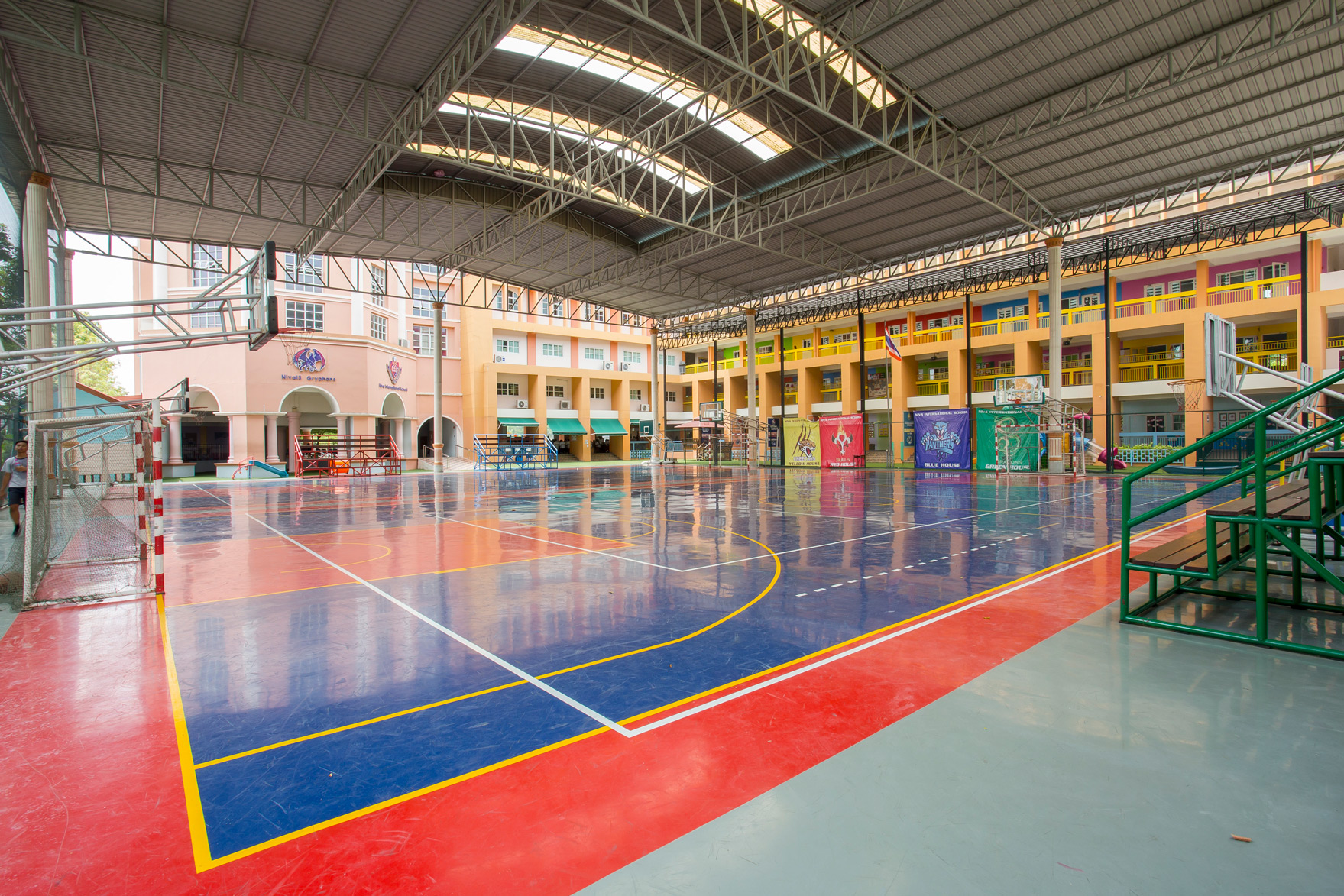Covered multi-purpose court with basketball hoops