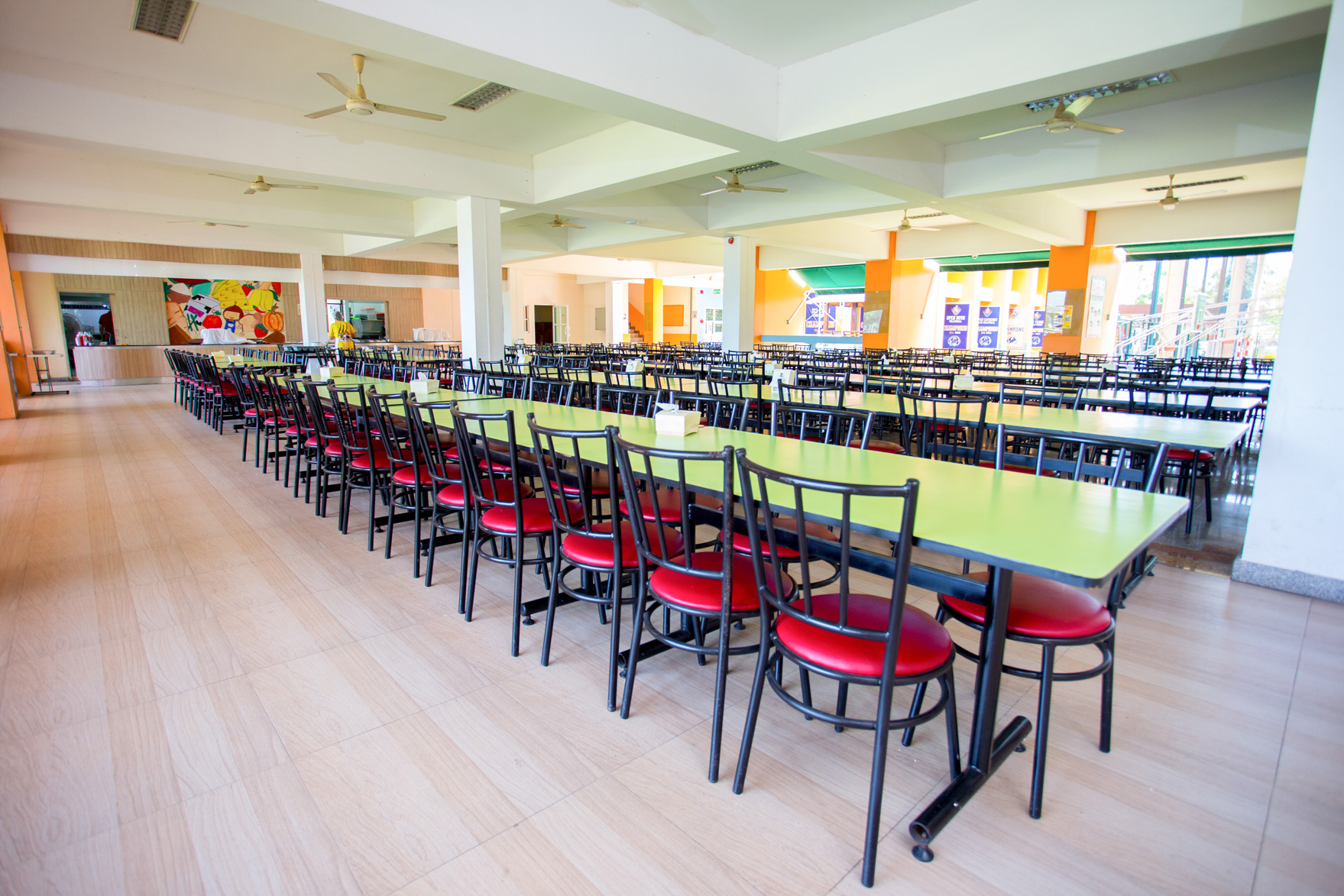 Rows of tables and chairs in the school canteen